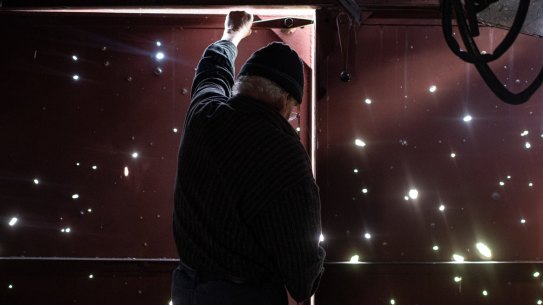 ZAHALTSI, UKRAINE - APRIL 28: Volodymyr Tykhonov, 76, opens the door of his garage that has numerous bullet holes, on April 28, 2022 in Zahaltsi, Ukraine. The towns around Kyiv are continuing a long road to what they hope is recovery, following weeks of brutal war as Russia made its failed bid to take Ukraine's capital. As Russia concentrates its attack on the east and south of the country, residents of the Kyiv region are returning to assess the war's toll on their communities.  (Photo by Alexey Furman/Getty Images)