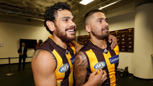 Cyril Rioli and Bradley Hill (right) after the win over the Swans.