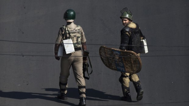 Indian paramilitary soldiers patrol during a curfew in Srinagar, Indian-controlled Kashmir.