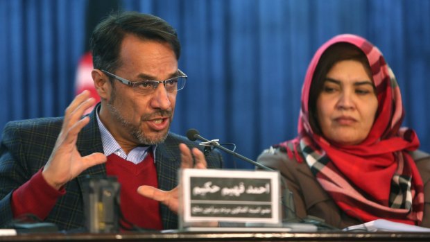 Ahmad Fahim Hakim, left, a member of the Afghan People's Dialogue on Peace Initiative, addresses a press conference in Kabul ahead of the Pakistan meeting.