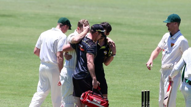 Adam Voges of the Warriors is helped from the field after being struck in the head by a bouncer from Cameron Stevenson during day one of the Sheffield Shield match between Western Australia and Tasmania at WACA on November 17, 2016 in Perth, Australia. (Photo by Gary Day/Getty Images)