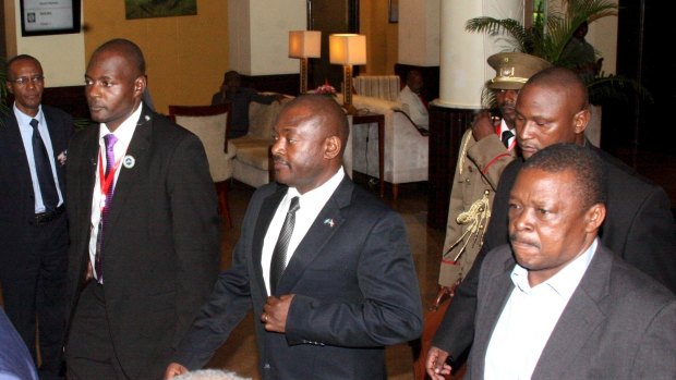 Burundi President Pierre Nkurunziza, centre, escorted to the aiirport in Dar es Salaam in Tanzania on Wednesday. 