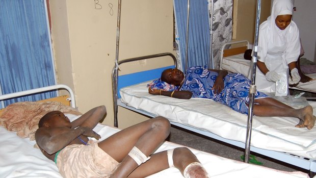 Victims of  a suicide bomb attack at a refugee camp receive treatment at a hospital in  Maiduguri, Nigeria, on Wednesday.