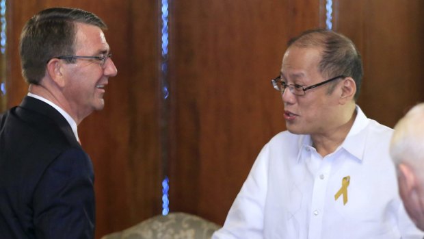 Philippine President Benigno Aquino III, right, shakes hands with US Defence Secretary Ash Carter last week. 