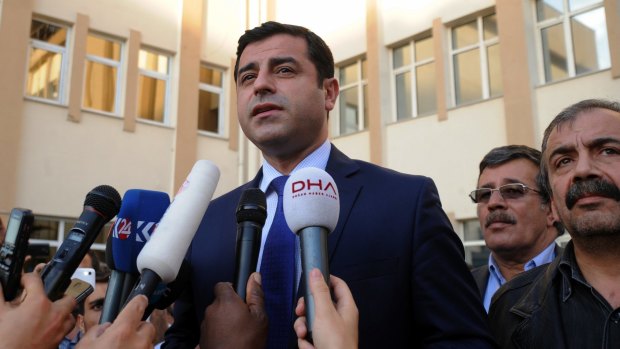 Selahattin Demirtas, leader of the opposition HDP, speaks to reporters after visiting relatives of people wounded in Saturday's attack.