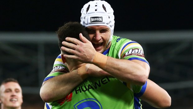 Nikola Cotric of the Raiders celebrates with teammate Jarrod Croker after scoring a try.