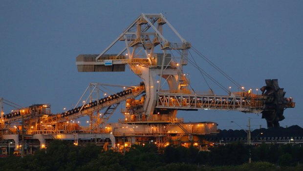 Coal-loading machinery rises above the Hunter River at Kooragang Island, Newcastle.
