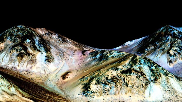 NASA says dark, narrow streaks flowing downhill on Mars were almost certainly formed by flowing water.