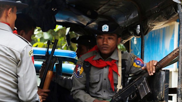 Myanmar police officers patrolling Maungdaw in Rakhine State, which neighbours  Bangladesh.