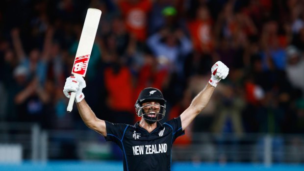 Missing his sister's wedding ... Grant Elliott of New Zealand celebrates hitting the winning runs during the World Cup semi-final against South Africa at Eden Park.