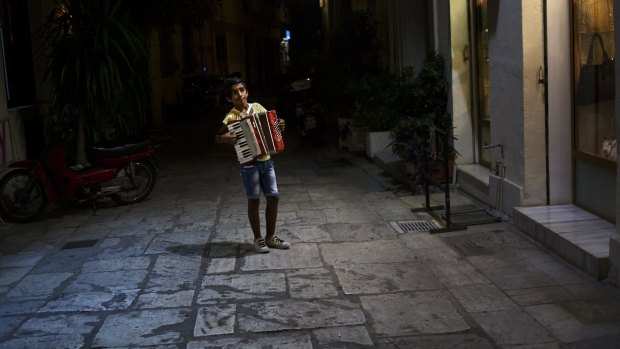 Playing for money in Plaka: Unemployment in Greece is above 40 per cent.
