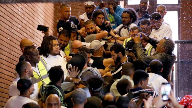 Protesters force their Kensington and Chelsea town hall on Friday to demand justice over the Grenfell Tower fire.