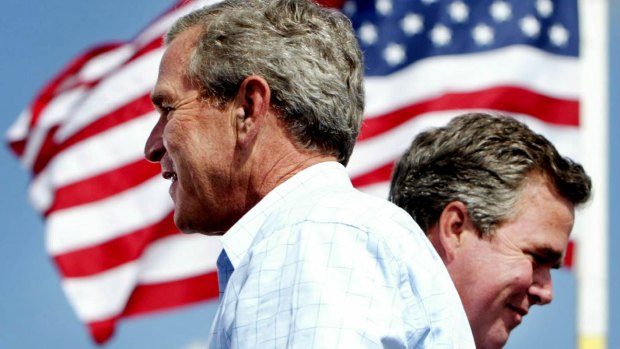 President Bush, left, is introduced by his brother Governor Jeb Bush, right at a campaign rally in 2004 