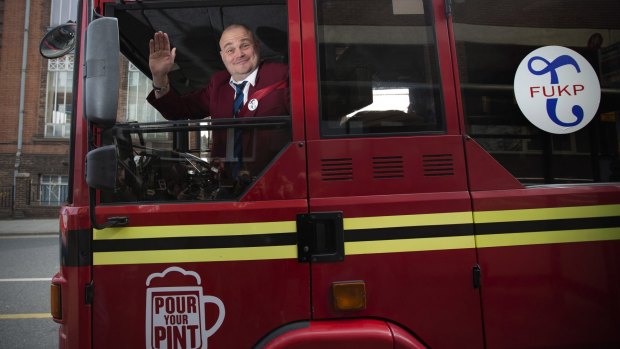 Alastair James Hay, better known as comedian 'Al Murray' who portrays an English pub landlord, arrives in a converted fire engine to hand in his nomination papers at Thanet council offices in 2015 in Margate, England. Hay, in his comic guise of Al Murray is standing in the South Thanet seat against UKIP leader Nigel Farage.