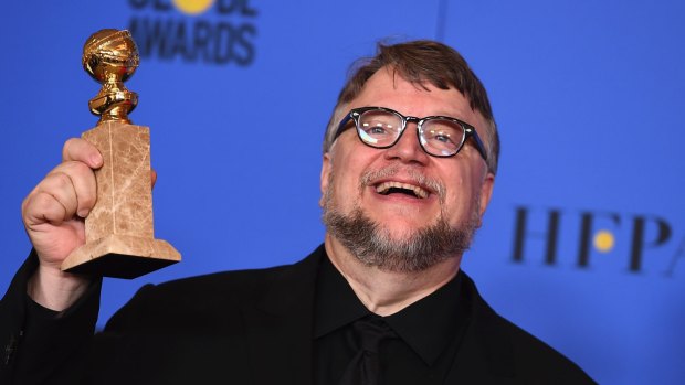 Guillermo del Toro with an award for best director (motion picture) for <i>The Shape of Water</i>.