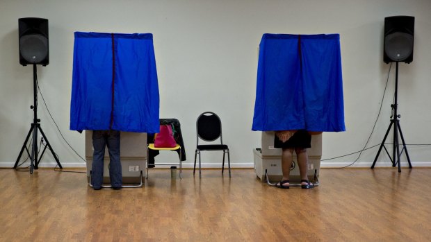 Residents use an electronic voting machine at a polling location in Philadelphia, Pennsylvania.