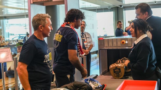Precious cargo as Johnathan Thurston checks in the prized possession he craved for his whole career.