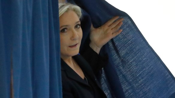 Far-right leader and candidate for the 2017 French presidential election Marine Le Pen exits a polling booth.