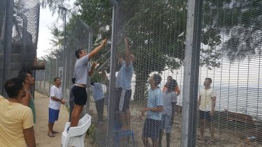Manus Island refugees secured damaged perimeter fences at the processing centre on Monday night, fearing possible attacks.