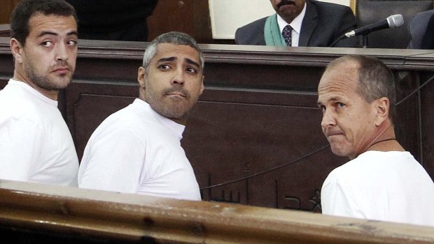 Al-Jazeera English producer Baher Mohamed, left, Canadian-Egyptian acting Cairo bureau chief Mohammed Fahmy, center and Australian Peter Greste in Egyptian court.