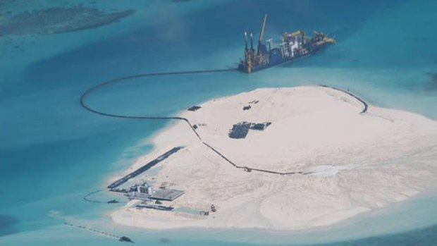 A February 2014 photo taken by surveillance planes for the Philippines government shows Chinese construction work on Johnson Reef in the disputed Spratly Islands. 