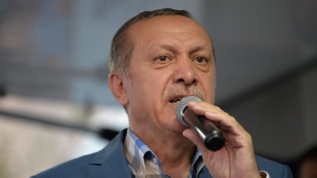 Turkish President Recep Tayyip Erdogan delivers a speech to his supporters in Istanbul after the failed coup.