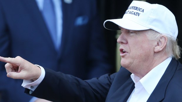 Republican presidential candiadte Donald Trump wearing a white baseball cap.