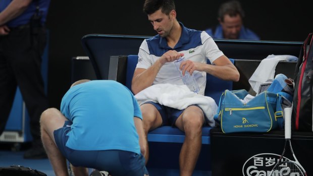 Novak Djokovic receives a medical timeout.