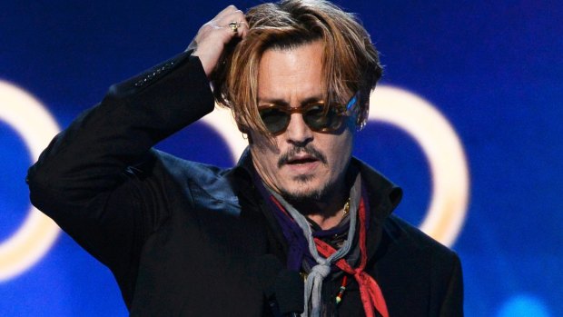 Here's Johnny! An apparently tired and emotional Depp presents the awards.