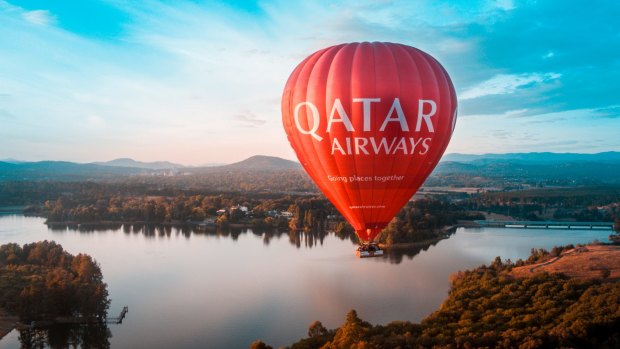The Qatar Airways balloon, flown by Balloon Aloft Canberra, flies over Canberra.