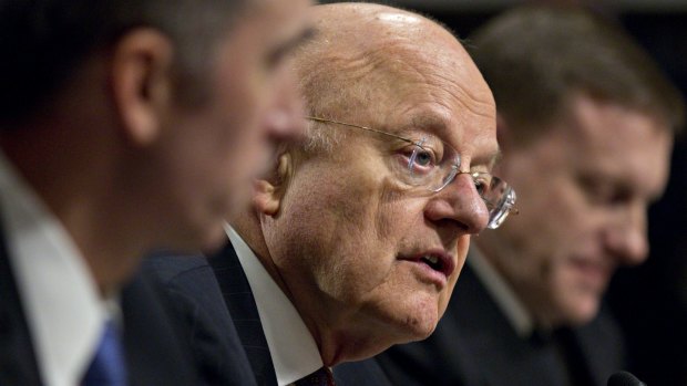 James Clapper, director of National Intelligence, centre.