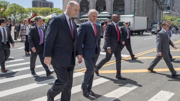 Malcolm Turnbull walks towards New York's Ted Weiss Federal Building with FBI Assistant Director, William F. Sweeney.