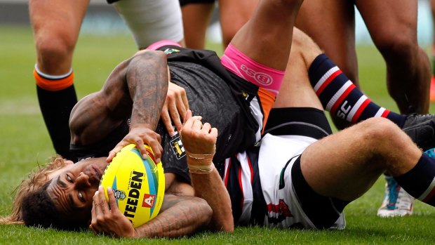 Kevin Naiqama scores for the Tigers during the quarter-final against the Roosters.