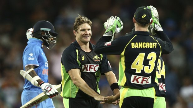 Cameron Bancroft right, celebrates with Shane Watson after the dismissal of India's Shikhar Dhawan in Sydney on Sunday.