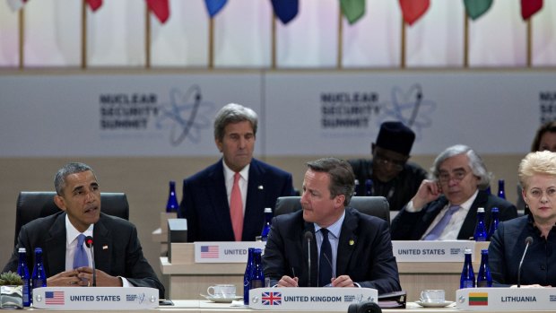 President Barack Obama, left, speaks during a closing session with UK Prime Minister David Cameron.