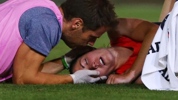 Meg Downie in trouble on Saturday night after the collision that has earned Magpie Sophie Casey a suspension.