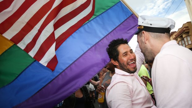 Two men taking part in San Franscisco's Gay Pride Weekend celebrate the US Supreme Court's ruling.