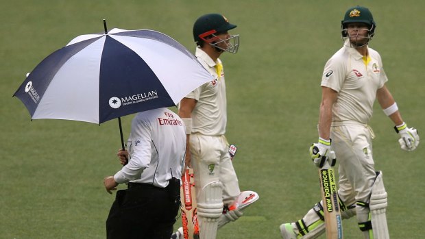 Downpour delight: Rain delayed play to make the draw an easier target for the Australians.