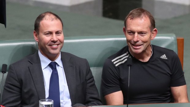 Mr Frydenberg sits alongside former prime minister Tony Abbott during a parliamentary vote last month.
