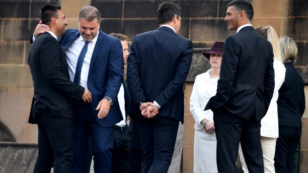Former footballer Nick Carle, Socceroo's coach Ange Postecoglou and Brisbane Roar coach John Aloisi (right), arrive for Les Murray's state funeral. 