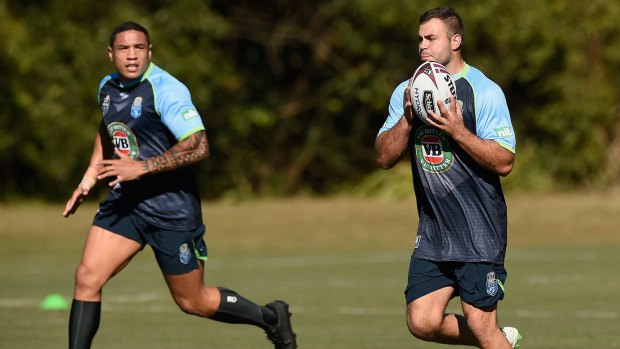 Raw deal: Wade Graham looks to pass the ball to the man who replaced him for Origin II, Tyson Frizell. Graham stayed in Blues camp in Coffs Harbour despite being ruled out of the match by the judiciary.