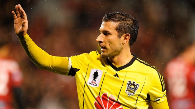 From navy blue to yellow: Kosta Barbarouses in action for Wellington.
