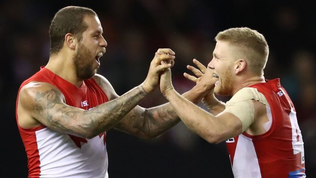 Fit and firing: Lance Franklin celebrates after kicking another goal with Dan Hannebery.