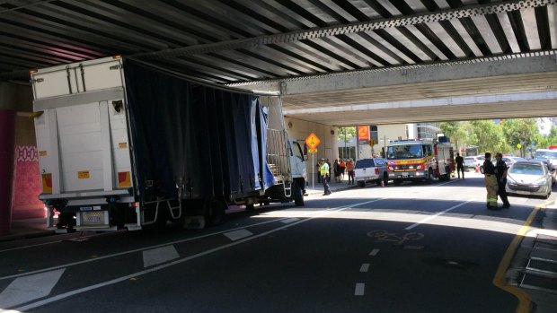 A truck is stuck under a South Brisbane bridge.