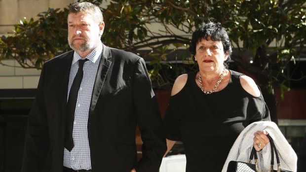 Late cricketer Phillip Hughes's parents Greg and Virginia Hughes arrive at the inquest. 