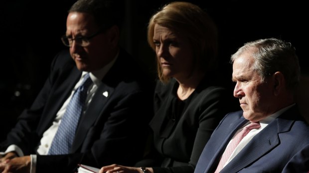 Former U.S. President George W. Bush listens to speakers at a forum sponsored by the George W. Bush Institute in New York.