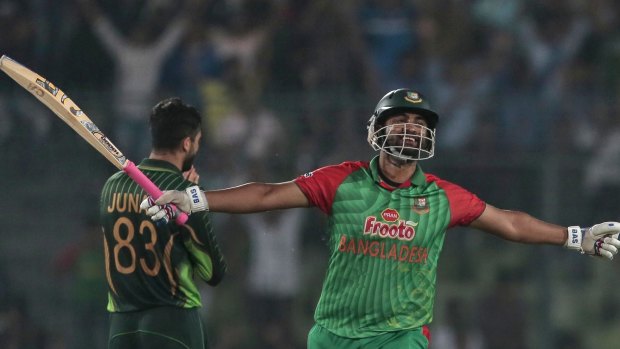 Bangladesh's Tamim Iqbal celebrates after reaching a century against Pakistan on Sunday.