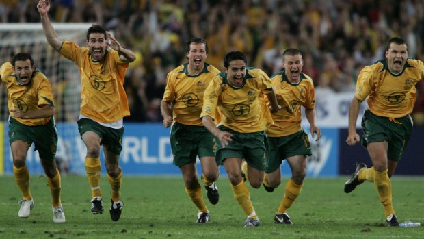 Socceroos players celebrate as John Aloisi scores the winner against Uruguay to qualify for the 2006 World Cup. 