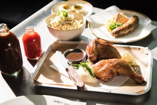 Smoked chicken, boudin sausage, sauces and coleslaw at Fancy Hank's new fancy digs.