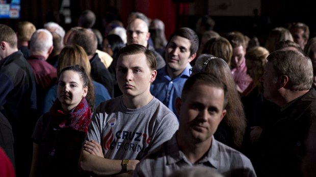 Attendees watch a television as primary results are discussed during an election night event for Senator Ted Cruz in Indianapolis, Indiana.